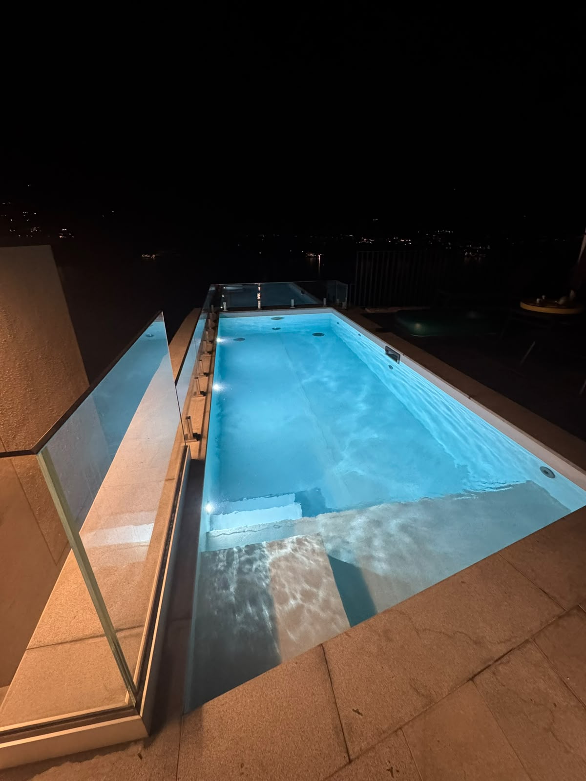 The pool at night, lit from within