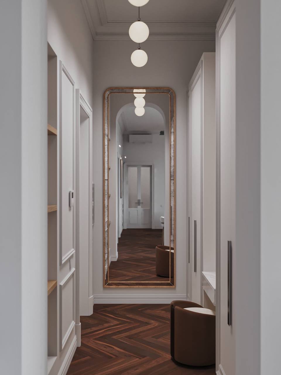 The corridor, lined by globe lights and a herringbone floor