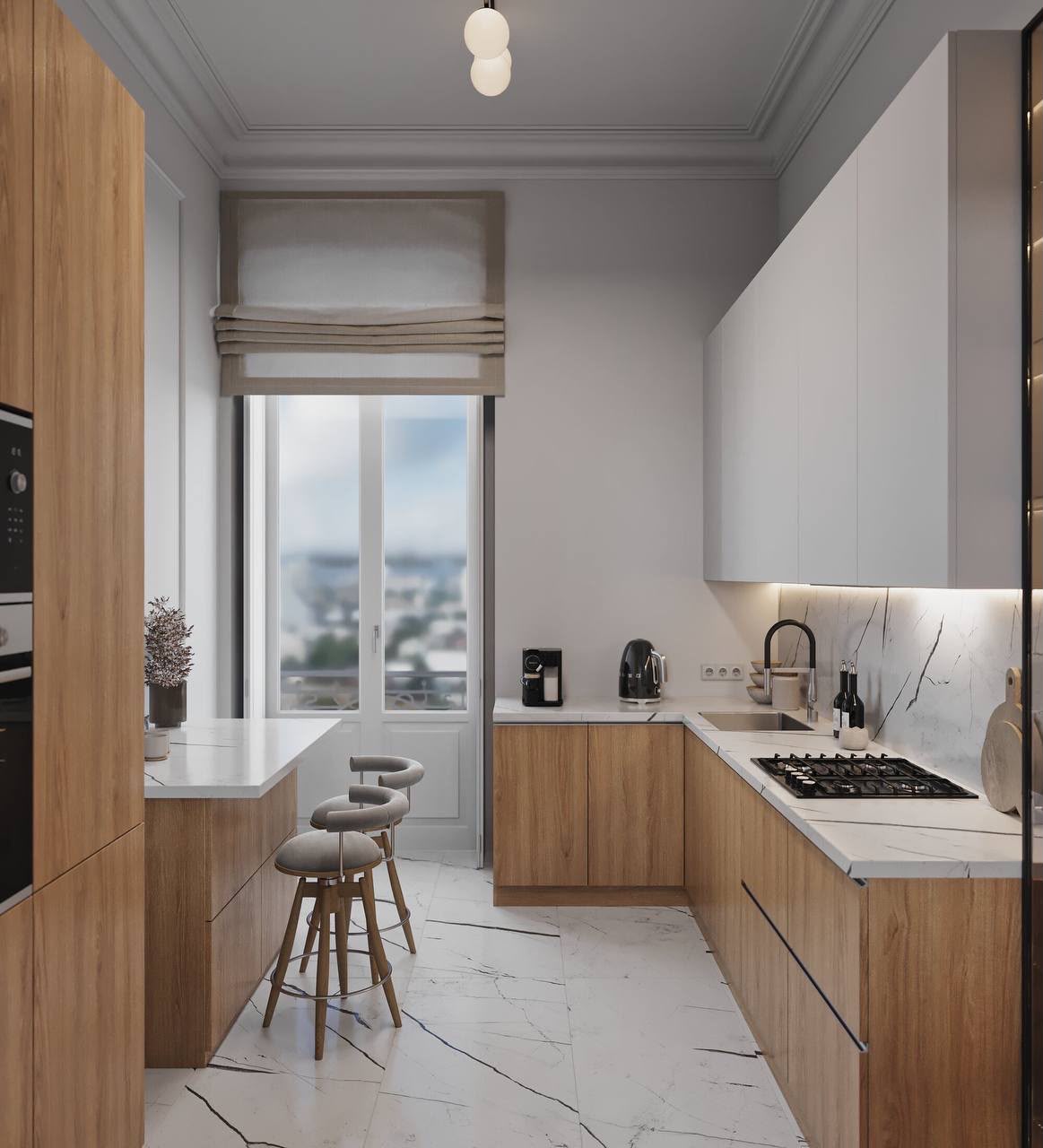 Kitchen in oak and marble, with a breakfast bar by the window