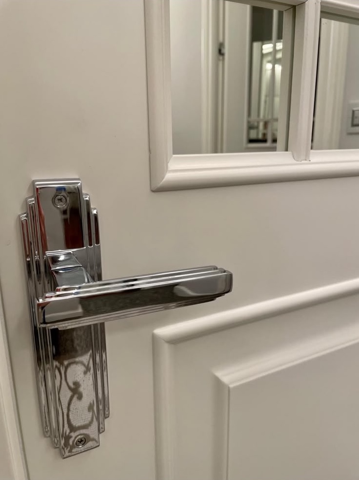 Detail: an art deco handle in polished chrome