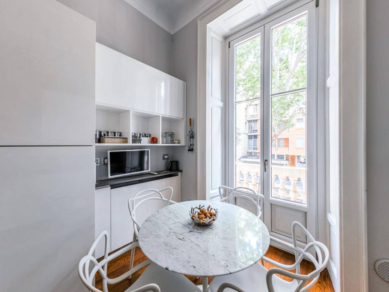Round marble table in the light of the window