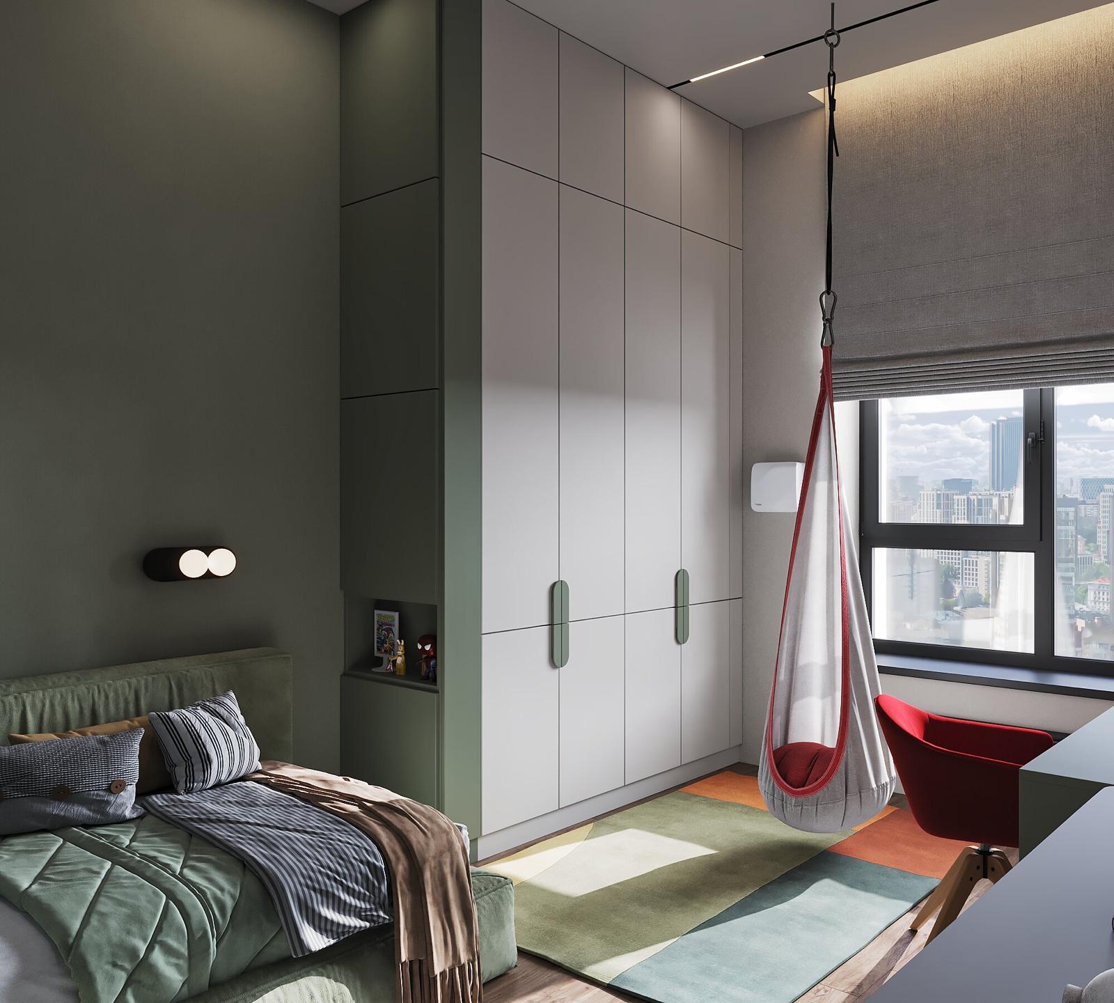 Second child’s room in sage green, with a red hanging chair