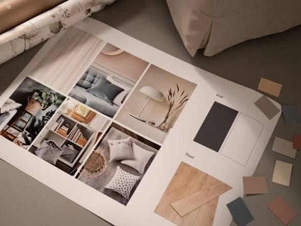 A mood board with fabrics, wall and floor samples, laid out on the studio table